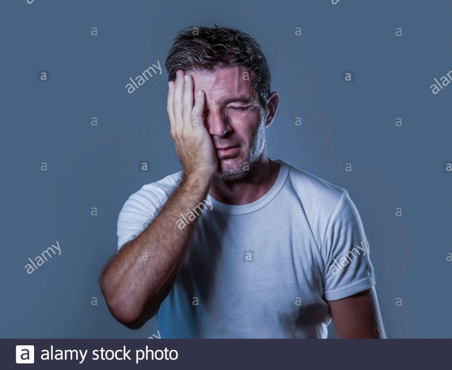 portrait-of-sad-and-depressed-man-with-hand-on-face-looking-desperate-feeling-frustrated-and-helpless-in-depression-and-sadness-facial-expression-conc-2BX9G55.jpg